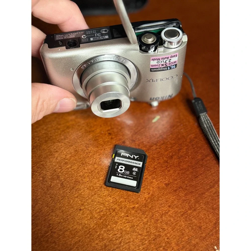 Nikon Coolpix L27 Silver 16.1MP Digital Camera 5x Zoom Bundle with 8GB SD Case